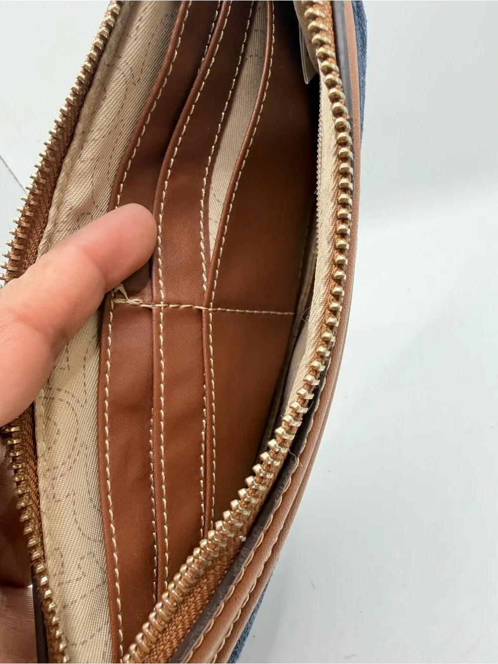 True Religion Denim Wristlet with Tan Trim and Gold Logo
